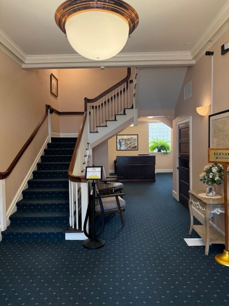 lobby area with stairs to Bachus & Schanker Wyoming office.